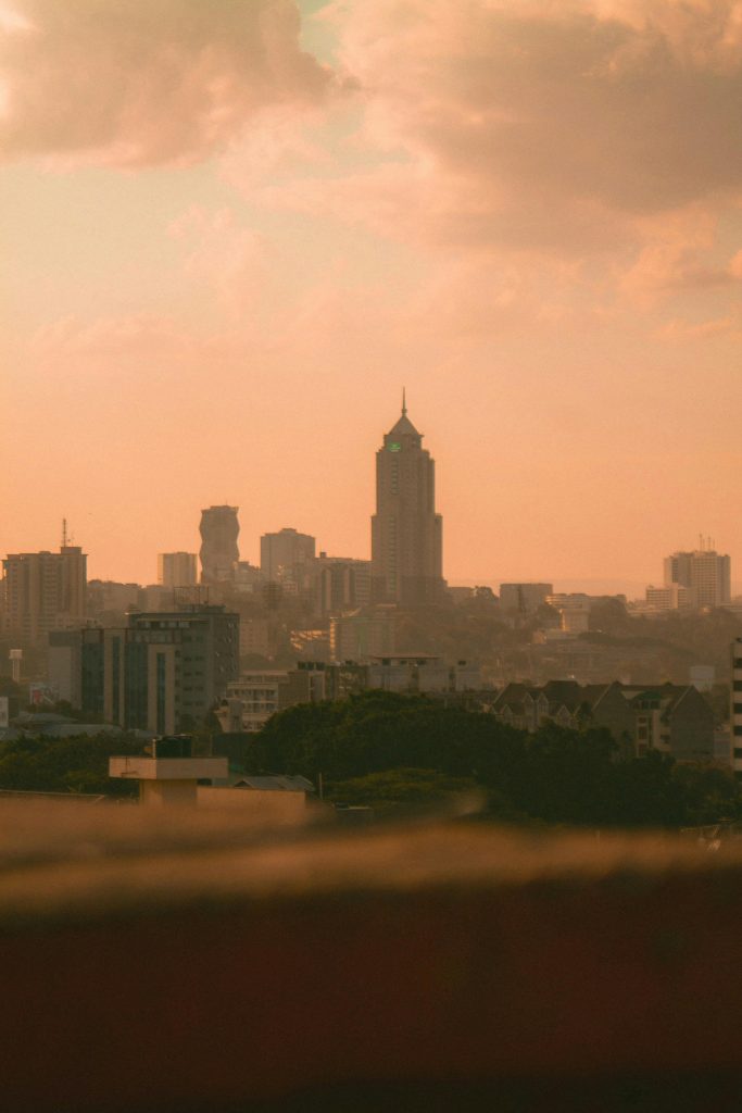 Stunning Nairobi skyline with modern skyscrapers and a dramatic sky at sunset.